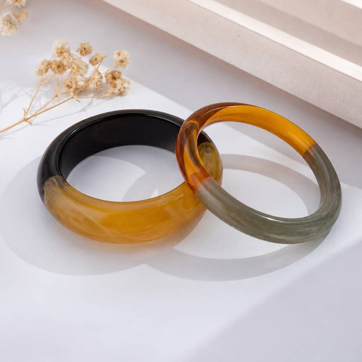 Sæt med 2 jonc-armbånd i harpiks – degradé i brun rav &amp; rav